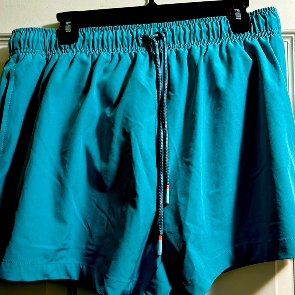 Polyester/Spandex teal shorts XLG. Normal length.  New